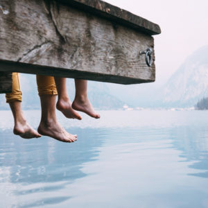 father and son hanging feet