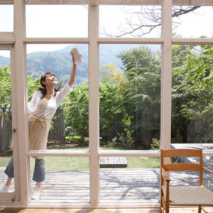 woman cleaning window