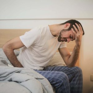 man can't sleep sitting in bed
