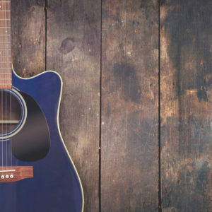 Guitar on wood background