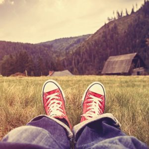 Boy relaxing in grass