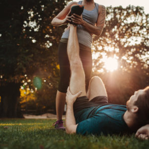 trainer helping stretch