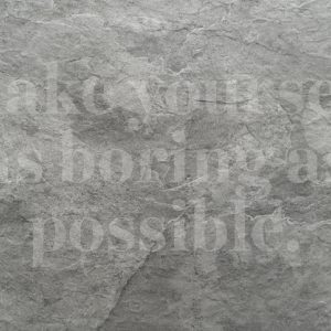 Grey rocky background with text "make yourself as boring as possible"