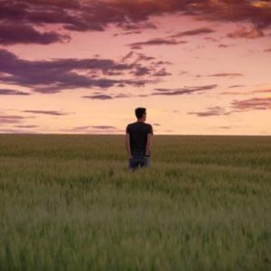 man standing in a field