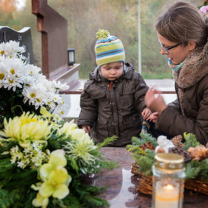 mom and son at grave