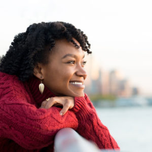 woman looking out happy