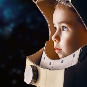 child with astronaut helmet