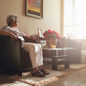 woman next to empty chair