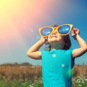 Child looking toward sun