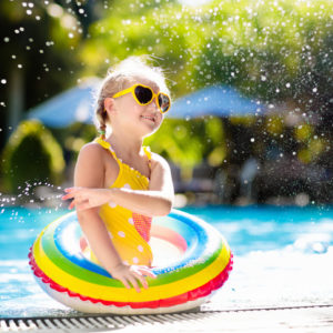 A girl plays in a pool