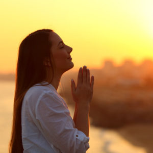 woman gives thanks