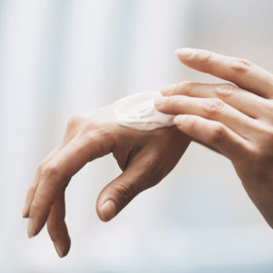 rubbing on hand cream