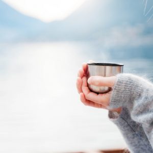 woman with cup benefits of drinking warm water