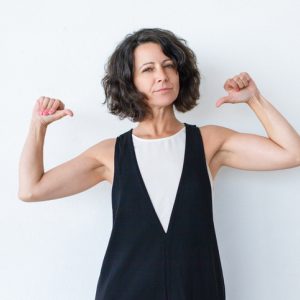woman pointing to self dependable strength
