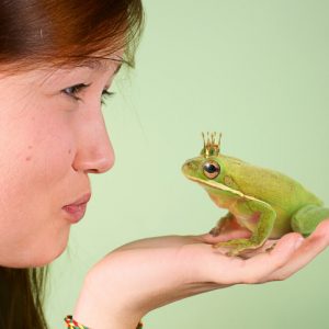 Woman kissing frog is humorously a nod to kambo ceremony, a wellness trend in 2021