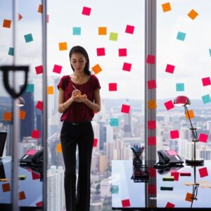 Woman in office with sticky notes