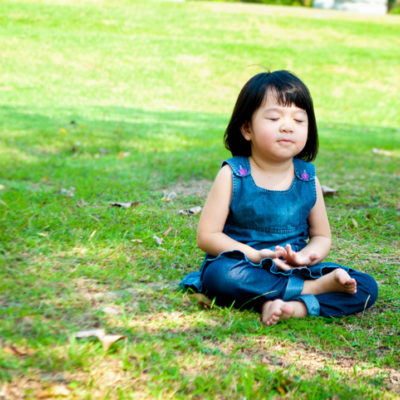 A child practices mindfulness