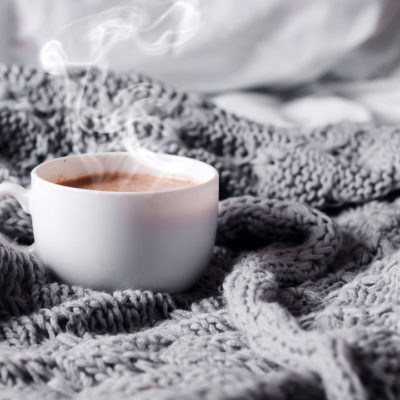 Cup of sleep tea on blanket