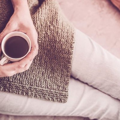 Woman relaxing with cup of coffee