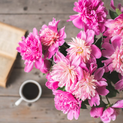 Flowers sit by a bible that could be used for divine reading, or lectio divina