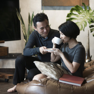 Man offering coffee to his wife