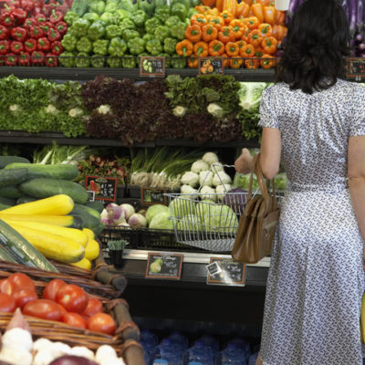 Woman standing in the produce aisle