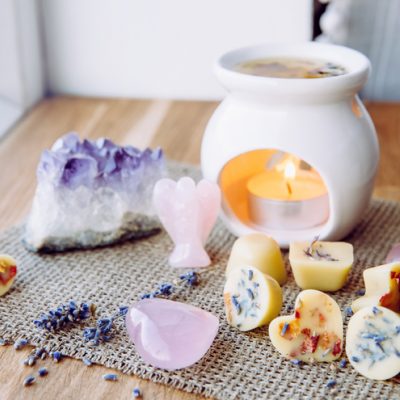 At home altar for spiritual practice with wax burning and candles