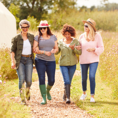 group of female friends on retreat walking together
