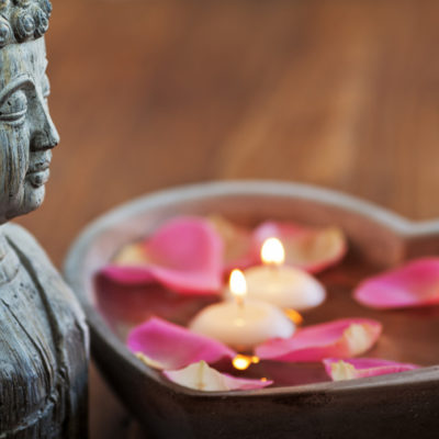 buddha statue and flowers