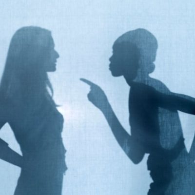 Silhouettes of women in argument