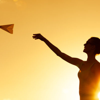 woman and paper airplane