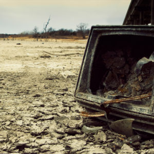 Broken TV sitting in a barren wasteland