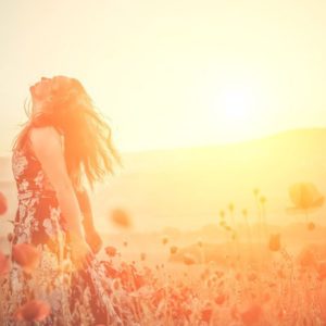 Woman embracing sunlight