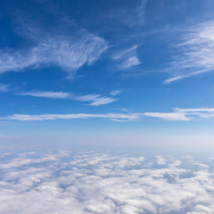 High above the clouds, a blue sky.