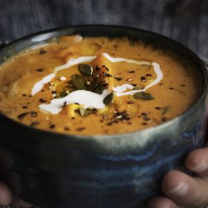 Hands offer hot and hearty bowl of soup