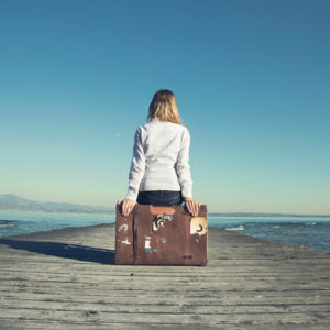 <img src="Woman on Suitcase with Pier" alt="Woman contemplating leaving"/>