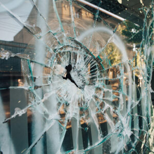 Window brokern during a violent insurrection