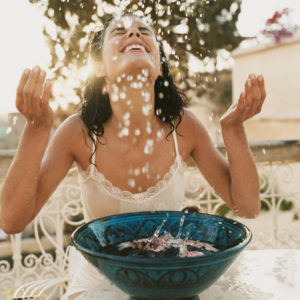 woman splashing water