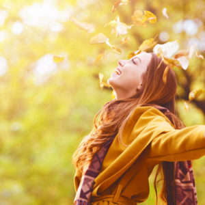 falling leaves on woman