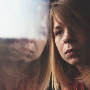 Woman looking out a window