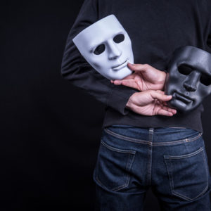 holding two masks