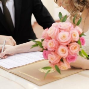 signing marriage document