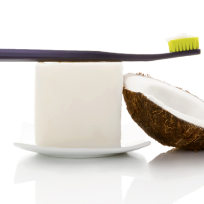 toothbrush and coconut for Ayurvedic oil pulling