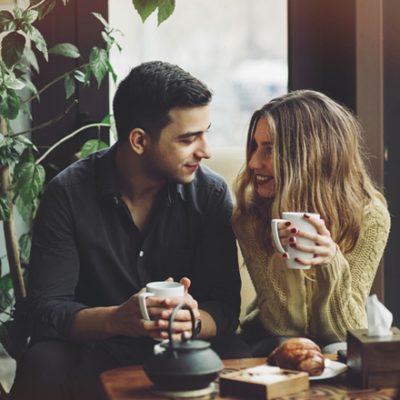 Caring couple at coffee shop