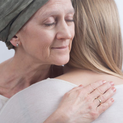 Caregiver and patient hugging