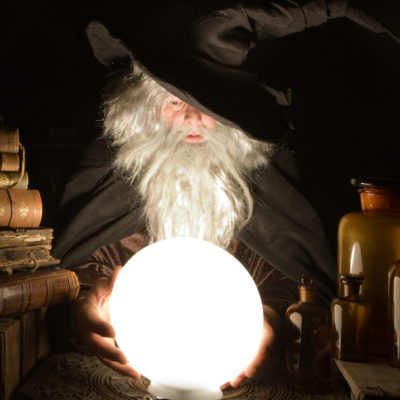 Wizard looking into the future with a crystal ball.