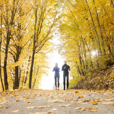 Couple running in fall