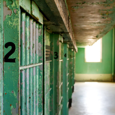 A historic prison with old, worn-down jail cells.