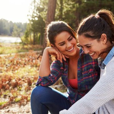 Happy lesbian couple in nature