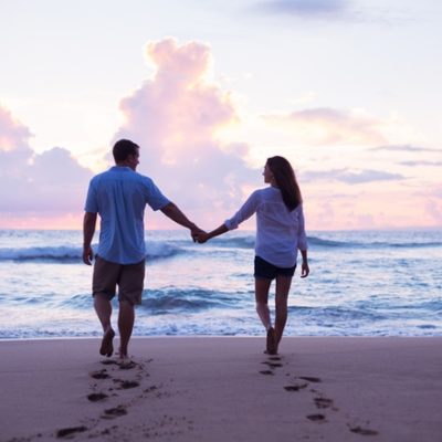 Couple walking on beach